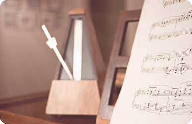 A metronome and some sheet music