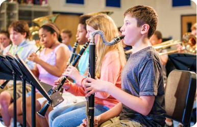 A photo of a student playing a rented instrument